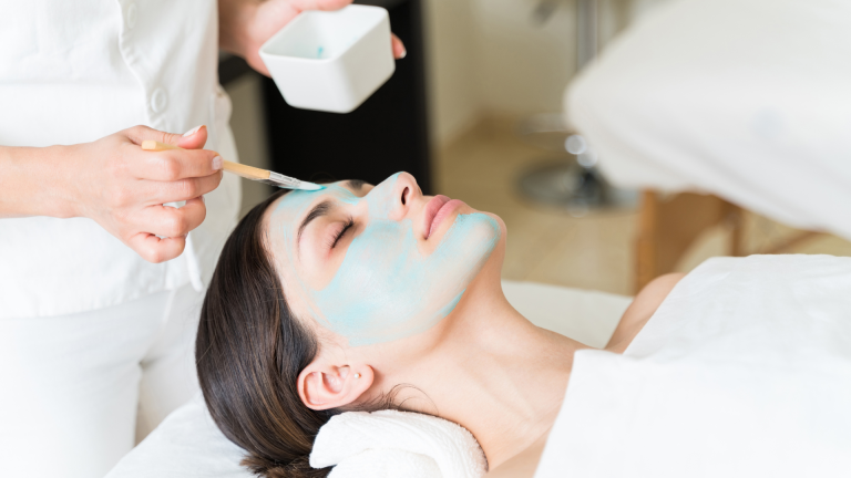 a person getting a facial treatment at a spa